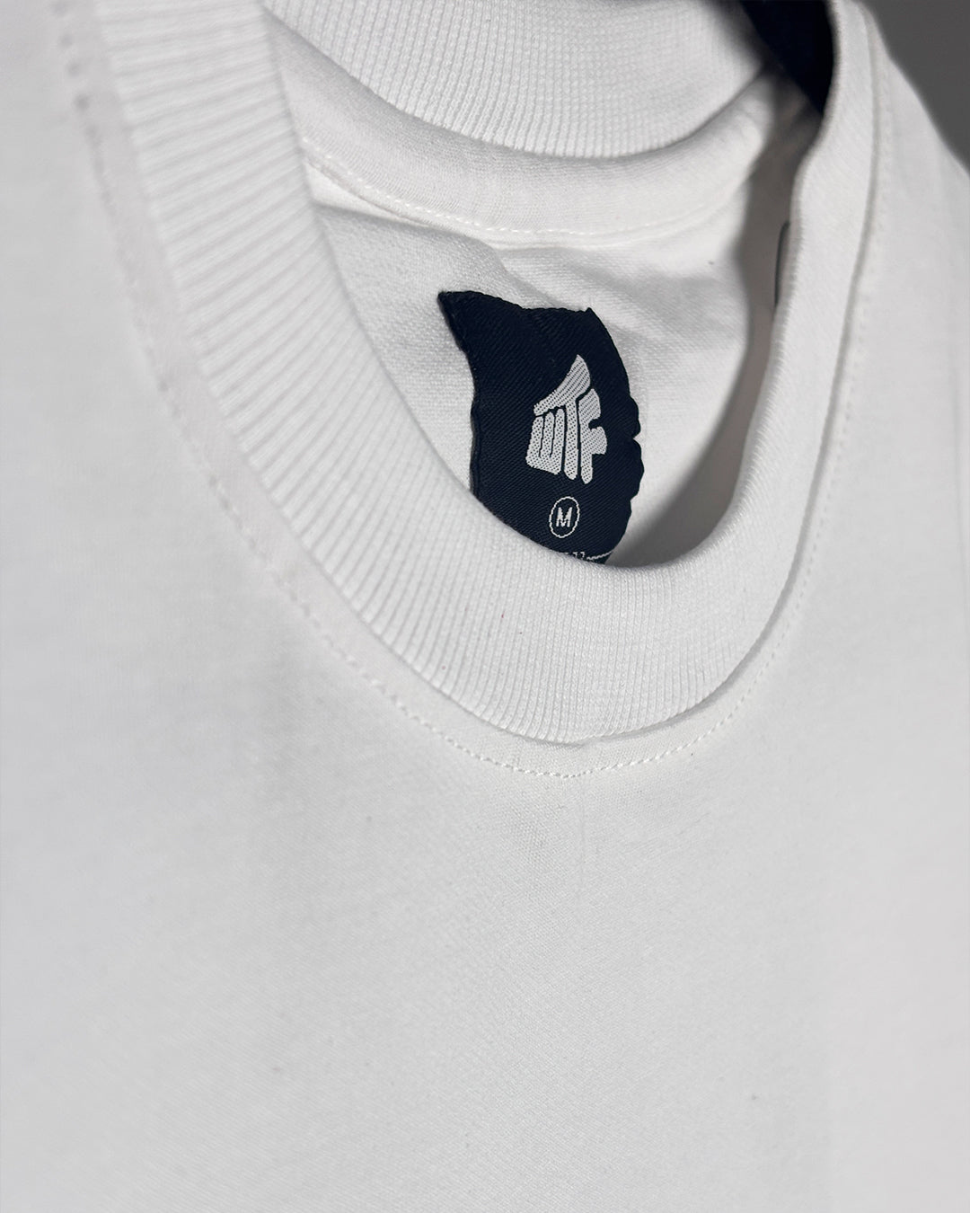 Unfollow The World White Heavyweight T-shirt